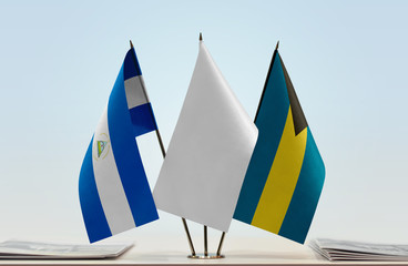 Flags of Nicaragua and Bahamas with a white flag in the middle