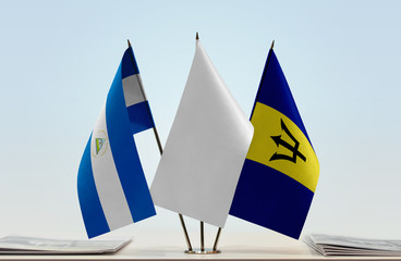 Flags of Nicaragua and Barbados with a white flag in the middle