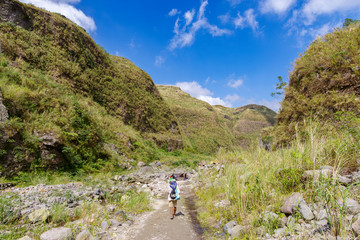 Fototapeta na wymiar Tourists hiking Mount Pinatubo