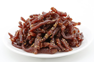 Sweet dried pork with sesame on white background