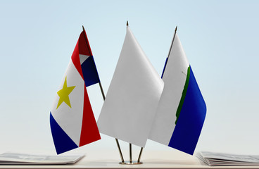 Flags of Saba and Navassa Island with a white flag in the middle
