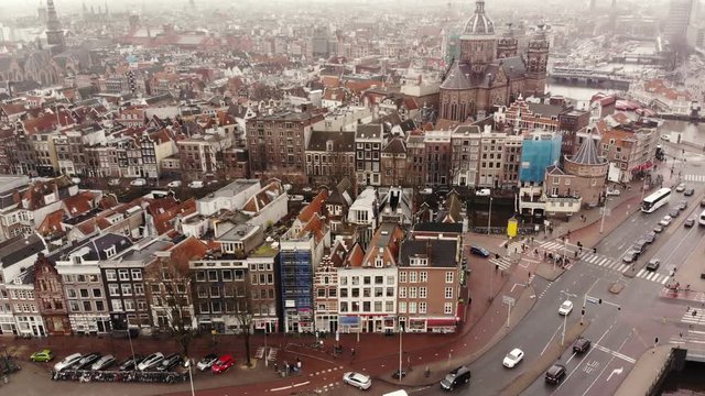 Central Amsterdam in a cloudy situation in an aerial shot.