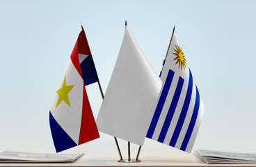 Flags of Saba and Uruguay with a white flag in the middle