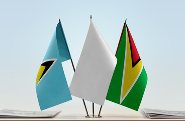 Flags of Saint Lucia and Guyana with a white flag in the middle