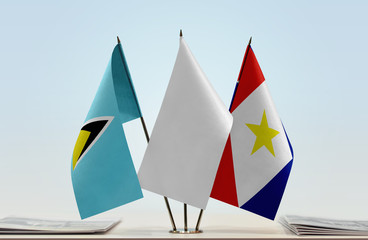 Flags of Saint Lucia and Saba with a white flag in the middle