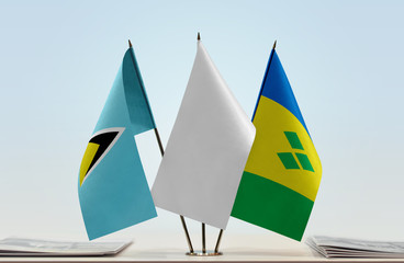 Flags of Saint Lucia and Saint Vincent and the Grenadines with a white flag in the middle