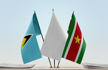 Flags of Saint Lucia and Suriname with a white flag in the middle