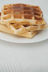 Belgian Homemade Waffles on White with Copy Space. Delicious Pancakes. Breakfast or Dessert.