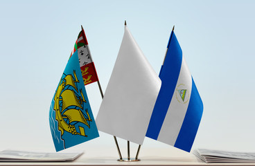 Flags of Saint Pierre and Miquelon and Nicaragua with a white flag in the middle