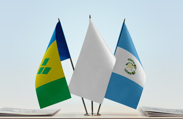 Flags of Saint Vincent and the Grenadines and Guatemala with a white flag in the middle