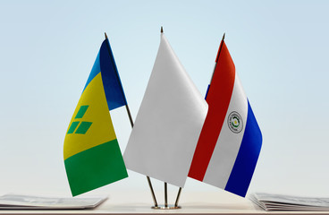Flags of Saint Vincent and the Grenadines and Paraguay with a white flag in the middle