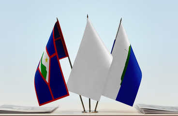 Flags of Sint Eustatius and Navassa Island with a white flag in the middle