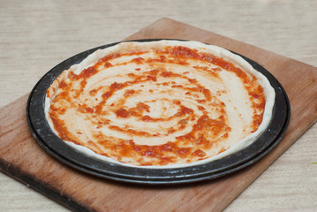 Homemade Pizza Cooking Process on Wooden Board. Process Step by Step. Pizza dough with tomatoe Pasta and ingredients.