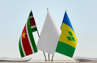 Flags of Suriname and Saint Vincent and the Grenadines with a white flag in the middle