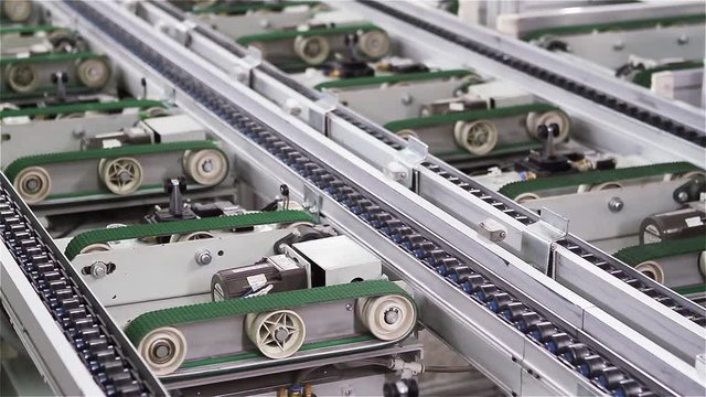 Roller Chains on Conveyor Belt at Computer Factory. Close Up.  