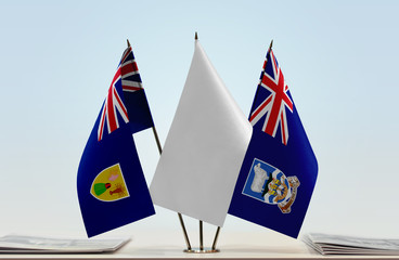 Flags of Turks and Caicos Islands and Falkland Islands with a white flag in the middle