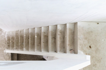 New house construction with concrete staircase at building site