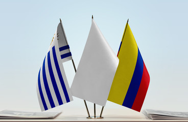 Flags of Uruguay and Colombia with a white flag in the middle