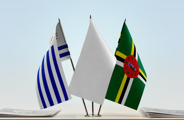 Flags of Uruguay and Dominica with a white flag in the middle