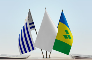 Flags of Uruguay and Saint Vincent and the Grenadines with a white flag in the middle