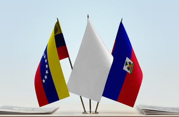 Flags of Venezuela and Haiti with a white flag in the middle