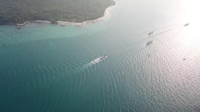 aerial footage from drone: Commercial fishing boat with sun light at Sattahip district Chon Buri, THAIALND