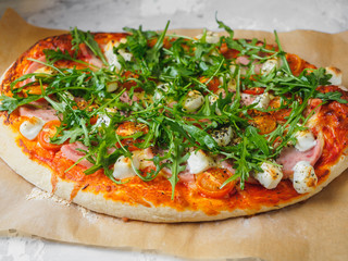 Hot homemade pizza on the grey background