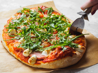 Hot homemade pizza on the grey background