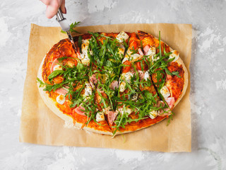 Hot homemade pizza on the grey background