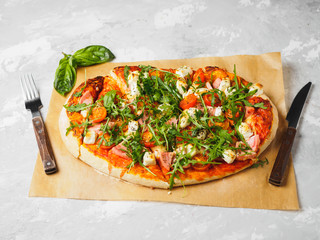 Hot homemade pizza on the grey background