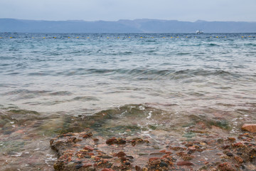 Sea and waves in cloudy day
