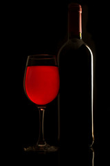 still life red wine bottle and glass of red wine