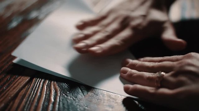 Origami Butterfly being Folded on Wooden Table
