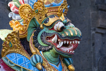 Traditional Balinese statue of Barong on a street temple in Bali, Indonesia
