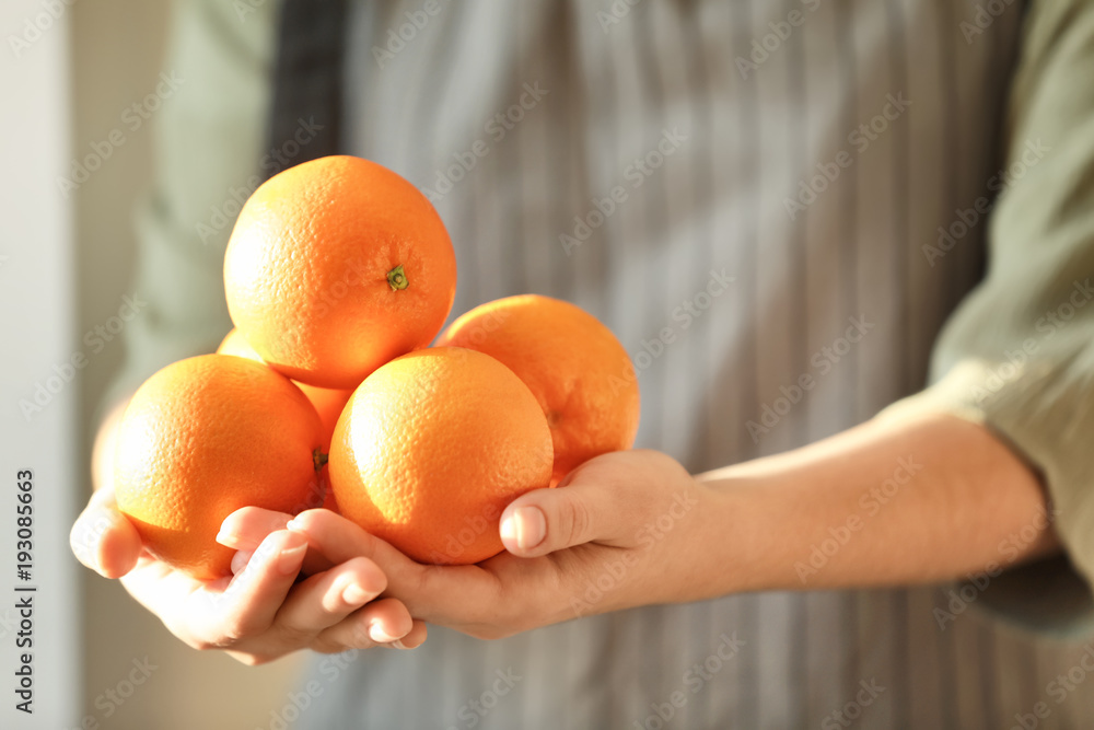 Sticker woman holding juicy ripe oranges, closeup - Stickers