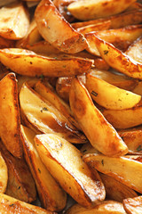 Tasty potato wedges, closeup