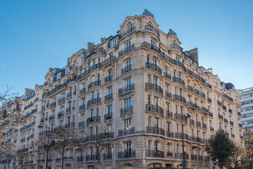 Fototapeta na wymiar Paris, typical facade in a charming district, beautiful building 