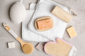 Soft towel and bath accessories on table