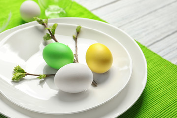 Beautiful festive Easter table setting with eggs