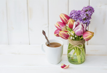 Cup of Coffee with Lilac and Tulips Flowers for  Good Morning 
