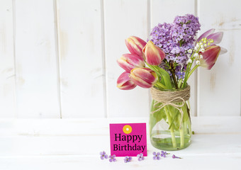 Happy Birthday Greeting Card with Spring Bouquet of Lilac and Tulips