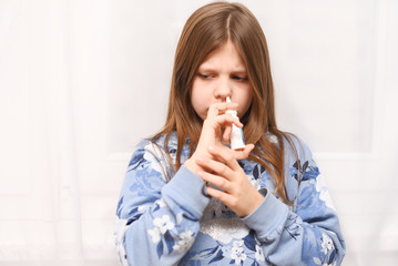 little girl with nasal spray