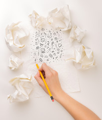 Writing hand in crumpled paper
