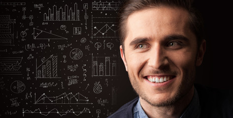 Portrait of a young businessman on dark background