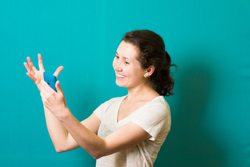 Fototapeta premium the girl is happy with the phone