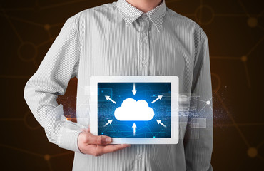 Businessman holding tablet with cloud icon