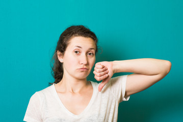 Fototapeta premium Girl showing thumbs down