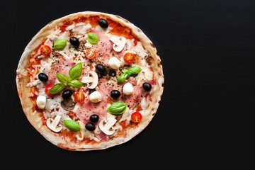 Pizza with ham, mozzarella cheese, pepper and olives menu chalkboard background  background.  Pizza with salami, ham and bacon with copyspace.