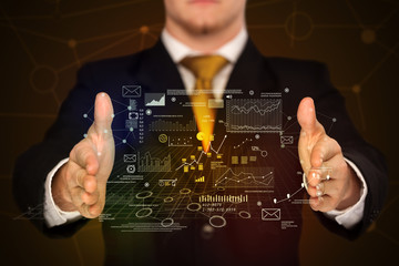 Businessman holding business plan graphics