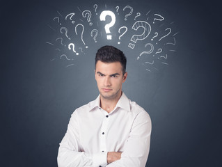 Businessman with question marks